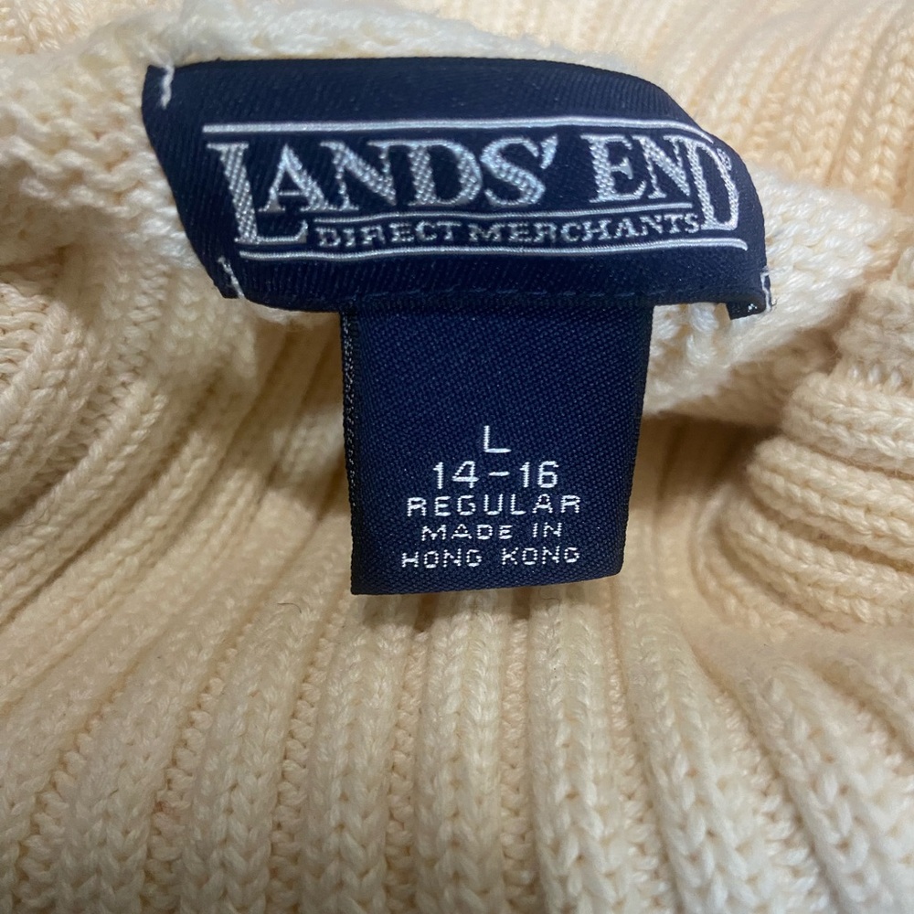 White colored vintage cable knit turtle neck sweater.